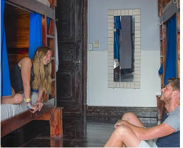 Guests hanging out in dorm room at Luna's Castle in Panama City, Panama